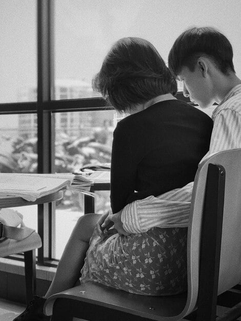A scene from a K-drama showing a couple in a contract relationship looking at each other with growing affection, highlighting the shift from a business arrangement to genuine feelings.