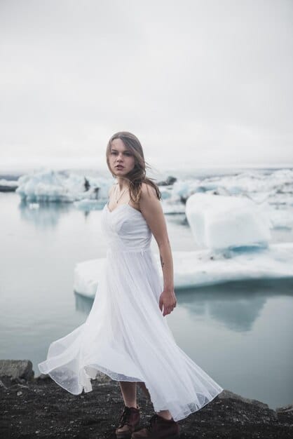 Captivating shot of a bride in a flowing, white wedding dress inspired by 