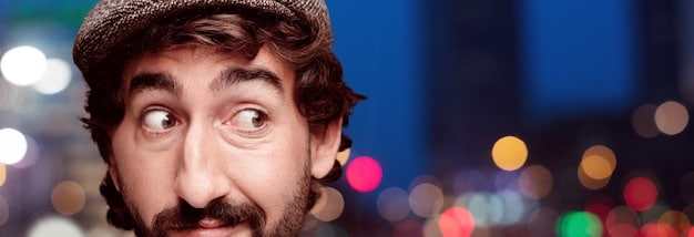 A close-up shot of a character's face expressing profound shock and realization, with blurred background elements suggesting a Japanese urban setting or a dimly lit interior, emphasizing emotional intensity.