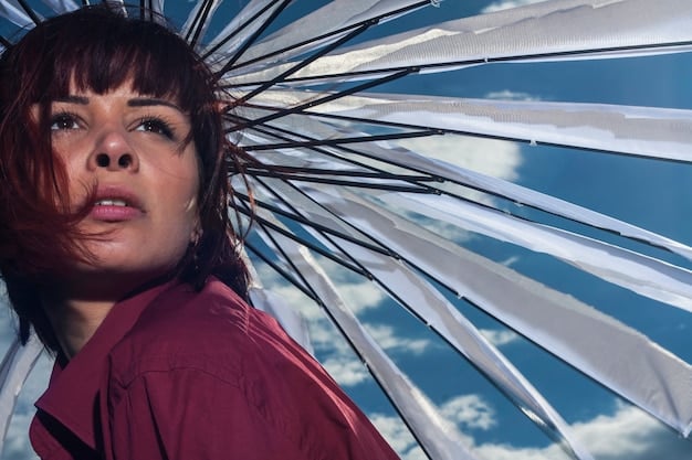 A close-up shot of the main character in , showing a moment of intense reflection. The focus is on their face, capturing the subtle nuances of their expression. The background is blurred, emphasizing the character's internal struggles.