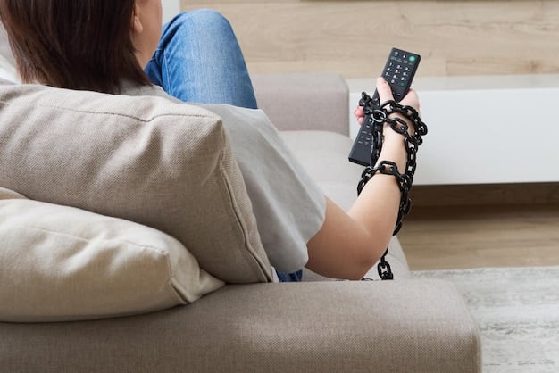 An image of a TV remote lying on a couch, with a hand reaching out to turn it off. The lighting is dim, suggesting a sense of boredom or frustration. This symbolizes the potential for viewers to lose interest if cliffhangers are overused or poorly executed.